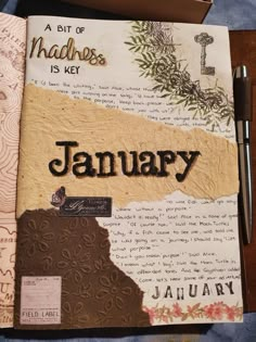 an open book with the word january written on it and a pen next to it