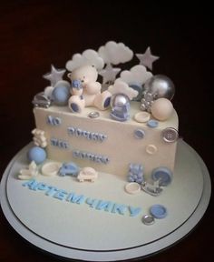 a white cake with blue and silver decorations