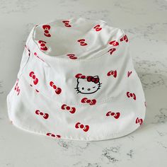 Shein Hello Kitty White Bucket Hat. This Super Cute Hello Kitty Bucket Hat Makes For The Perfect Finishing Touch To Any Look. This Super Cute Bucket Hat Comes In A Hello Kitty Red Print With A Wide Brim, And Canvas Construction. It Has An Adjustable Strap For A Perfect Fit. Excellent Conditions. Brand New With Tag Trendy White Bucket Hat, Adjustable White Playful Bucket Hat, Playful White Adjustable Bucket Hat, Playful Adjustable White Bucket Hat, Playful White Cotton Hat, Cute White Cotton Bucket Hat, White Adjustable Kawaii Hat, Playful White Bucket Hat, Cute White Hat, One Size