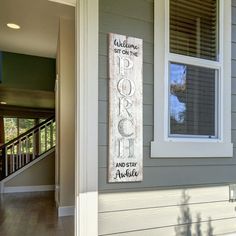 a welcome sign on the front door of a house