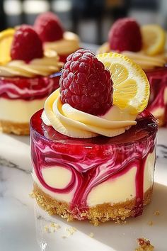 Luscious Lemon Raspberry Swirl Cheesecake Cups Sweets In Cups, Dessert Tin Ideas, Christmas’s Deserts, Raspberry Cream Cheese Cupcakes, Cookies With Cheesecake Filling, Must Try Dessert Recipes, Mini Cheesecakes In Muffin Tin, Baking Cups Ideas, Lemon Cream Cheese Muffins Recipes