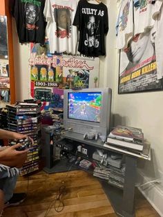 a room filled with video games and t - shirts