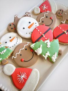 decorated christmas cookies on a white plate