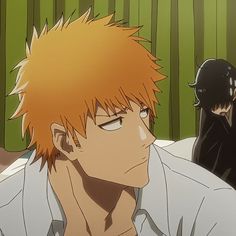 an anime character with orange hair and white shirt in front of two other characters wearing black masks