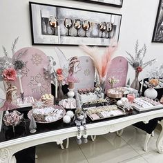 a table topped with lots of plates and desserts