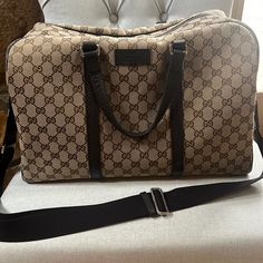 Authentic Gucci. Used Couple Of Times, Excellent Condition! Like New!!! Canvas W/ Leather Trim. Classic Gc Pattern. Great As An Overnight Bag, Gym Bag Or Carry-On. Fits Under Airline Seats. Comes W/Adjustable Strap And Dust Bag. 16l X 9w X 11h Gucci Duffle Bag, Airline Seats, Bags Gucci, Bag For Travel, Overnight Bag, Leather Trim, Leather Trims, Travel Bags, Gym Bag