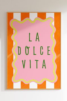 a pink and yellow striped wall with the words la dolce vita written in black