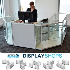 a woman sitting at a desk in front of a computer monitor with display shops on it