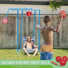 two boys playing in the back yard with balls and an inflatable pool toy