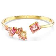 This romantic bangle is inspired by the delicate hues of Japan’s cherry blossom flower. The open-ended design is gold-tone plated and features a diverse mix of fancy cut crystals and Swarovski Zirconia in vibrant shades of pink and champagne. Wear this piece alone to embrace nature-infused beauty, or pair it with a matching piece from our exquisite Gema Sakura jewelry family. Sakura Jewelry, Pink And Champagne, Pink Gold Jewelry, Swarovski Jewelry Earrings, Cherry Blossom Flower, Bracelet Tennis, Pink Watch, The Bangles, Embrace Nature