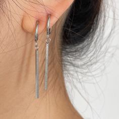 Accessorize with ease using these unisex stainless steel dangling long bar clip-on earrings, perfect for both men and women. Embrace a minimalist style with these sleek and contemporary earrings designed for non-pierced ears. Crafted from durable stainless steel, these earrings are both fashionable and versatile, adding a touch of modern sophistication to any outfit. Upgrade your accessory game effortlessly with these stylish clip-on earrings. ▪️▪️▪️PRODUCT Sold by Pair=2pcs Earring Full Height 4.8cm Inner Hoop 10mm, Outer Hoop 14mm  316L surgical stainless steel  Never Fade and Hypoallergenic VISIT STORE FOR MORE PRODUCT 🔗 https://www.etsy.com/ca/shop/TWISTEEL ▪️▪️▪️ S H I P P I N G   All orders will be shipped on the next business day UNITED STATES  - USPS First-Class Mail * 4 - 14 Busi Silver Clip On Earrings, Outfit Upgrade, Hoop Earrings Silver, Contemporary Earrings, Titanium Jewelry, Dangle Hoop Earrings, Nose Rings Hoop, Mismatched Earrings, Funky Jewelry