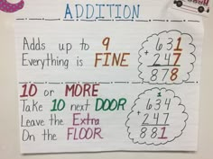 a sign that says addition add up to fine and 10 more than the extra one on the floor