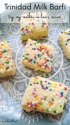 some kind of cake with sprinkles on it sitting on a blue plate