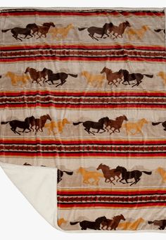 a blanket with horses on it and an orange, brown, black, and white background