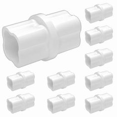 white plastic fittings for various types of pipes and connectors on a white background