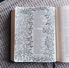 an open book sitting on top of a carpet