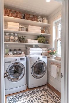 a washer and dryer in a small room with open shelving on the wall