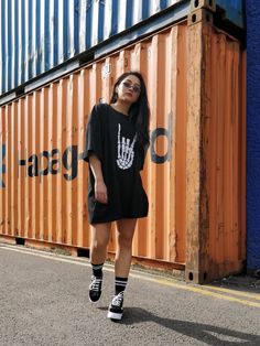 Halloween collection by Boisterous London, handmade here in the U.K. Each t-shirt is hand printed. Features contrast white halloween skeleton rock and roll logo, short sleeves, round ribbed neckline, comes in a unisex oversized loose fit.  SIZING AND CARE Model height 5ft 5 model is a size small. Model is wearing a size M. T-shirt comes oversized in a loose baggy fit. Please check exact chest measurements for desired size.  S chest 43/44 inches or 112cm Shoulder to hem 82cm,  M chest 45/47inches Rocker Short Sleeve T-shirt For Streetwear, Rock Style Crew Neck T-shirt For Streetwear, Oversized Alternative T-shirt For Halloween, Rock Style Short Sleeve T-shirt For Fall, Edgy Halloween Streetwear T-shirt, Rocker Crew Neck T-shirt For Alternative Fashion, White Rocker T-shirt For Streetwear, Black Rock T-shirt With Skull Print, Halloween Rock Style Crew Neck Tops