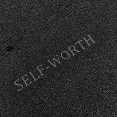 the word self - worth written in white on asphalt