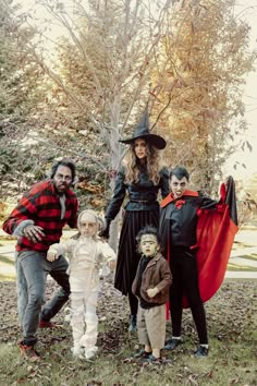 a family dressed up for halloween posing for a photo