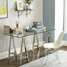 a glass desk with a chair next to it and the words best home office desks