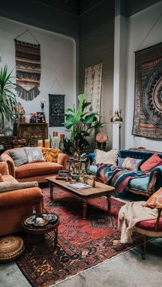 a living room filled with lots of furniture and rugs