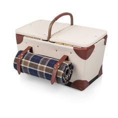 a white suitcase with plaid lining and leather handles