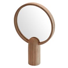 a wooden mirror on a white background