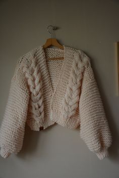 "Chunky Knit Cardigan, Cropped Chunky Sweater, Hand Knitted Jumper, Open Style Cardigan, Chunky Jacket, Sweater Women's Cozy, Ecru Sweater Loose fit One size Oversized Color ecru Lenght 16,53\" (42cm) Width 22,80\" (58cm) Lenght of sleeve 15,74\" (40cm) This warm cardigan is knitted by me from a thick yarn 5% Mohair, 10% Wool 85% Premium Acrylic Handmade. Clean by hand in very delicate detergent. Dry flat. Standard shipping is 10-16 days usually FAST SHIPPING Shipping via FedEx is also possible Flowers For Scrapbooking, Chunky Jacket, Hand Knit Headband, Hand Knitted Jumpers, Warm Cardigan, Cardigan Crop, Jacket Sweater, Sweater Oversized, Cable Knit Jumper