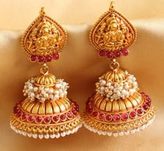 I found this beautiful design on Mirraw.com Mehndi Jewellery, Gold Jhumkas, Temple Jewellery Earrings, Gold Jhumka, Gold Earrings Indian, Gold Jhumka Earrings, Gold Jewelry Simple Necklace, Jewelry Photoshoot, Real Gold Jewelry