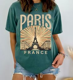 Elevate your wardrobe with this stylish Paris, France tshirt, featuring a chic Eiffel Tower design. Made from soft, high-quality cotton, this shirt is perfect for lovers of Paris and travel enthusiasts. Its timeless design makes it an ideal gift for anyone who appreciates the charm and romance of the City of Lights. Whether you're strolling through your local park or planning your next adventure, this T-shirt will keep you comfortable and fashionable. Available in various sizes and colors, it's Paris Tshirt Designs, Perfect Live, Tower Design, Limassol, Life Design, Look Plus, Favorite Shirts, Paris France, Comfort Colors