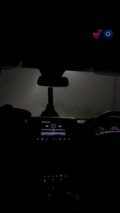 the interior of a car at night with lights on