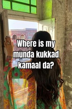 a woman standing in front of a window with the words where is my munda kukkad kamal da?