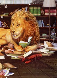 a lion laying on the floor with books all over it's body and head