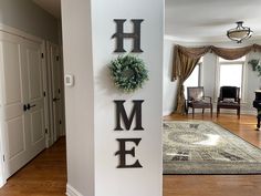 there is a sign that says home on the wall