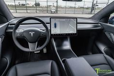 the interior of a tesla car with an electronic display