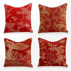 four red and gold decorative pillows with birds, flowers, and waves on the sides