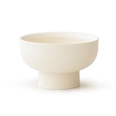 a white bowl sitting on top of a table