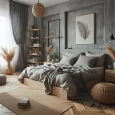 a bedroom with grey walls and wooden floors, large bed in the center surrounded by gray linens