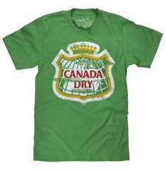 PRICES MAY VARY. YOUR NEW FAVORITE CANADA DRY SHIRT: Enjoy the nostalgia of the classic Canada Dry Ginger Ale logo - distressed and printed on the softest green Kelly Heather tee we could find. EASY CARE TEES: This Canada Dry design is licensed and screen-printed on a soft, poly-cotton t-shirt that goes from the washing machine to the dryer without losing shape, shrinking or fading. Graphic is intentionally distressed for a worn, vintage look. NO FUSS SIZING: Tee Luv's soda logo shirts feature a Dry Logo, Dry Ginger, Mens Fade, Retro Logos, Casual Night Out, Ginger Ale, Retro Logo, Graphic Tee Shirts, Logo Tees