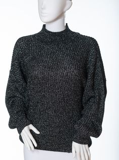 This listing is for a vintage metallic mock turtleneck sweater by Chaus.  The sweater is made from a very cool metallic fabric, black with metallic silver threads throughout. The sweater has a nigh, mock turtleneck and long sleeves. It is a pull-on/pull-off sweater.  Tina the Mannequin adores this metallic sweater! It's so very 90s! And Tina loves the 90s. And metallic thread. She loves metallic thread. Tina thinks this sweater is almost as cool as you are. Almost. Tag: Chaus Made in Korea Size: M Materials: 81% Acrylic 13% Metallic Mock Turtleneck Sweater, Metallic Sweater, Metallic Fabric, Fabric Black, Teardrop Necklace, Mock Turtleneck, Pull Off, Blue Rhinestones, Metallic Thread