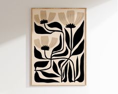 a black and white painting hanging on the wall