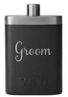 a black flask with the word groom written on it