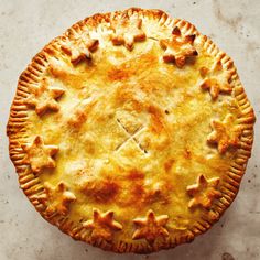 a freshly baked pie with stars on it's crust, ready to be eaten