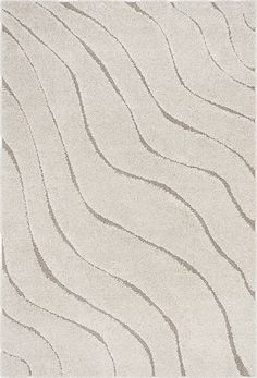 a white rug with wavy lines on it