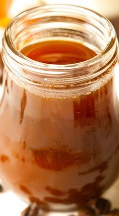 a jar filled with liquid sitting on top of a table