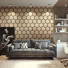 a living room with a couch, chair and book shelf in front of a hexagonal wall