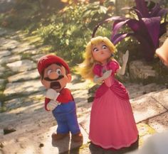 mario and princess peach standing next to each other