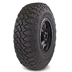 an all terrain tire on a white background