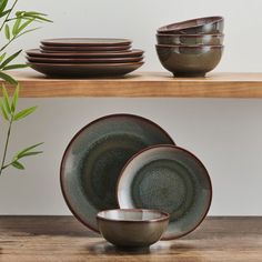 Bring contemporary allure to your dining table with this pfaltzgraff mackensie 12-piece dinnerware set. Crafted of strong and durable high-quality stoneware for long-lasting beauty, this eye-catching collection is a mesmerizing combination of earthy shades of blue and brown, creating an organic visual effect that commands attention. Perfect for elevating everyday meals or light entertaining, this elegant dinnerware features a reactive glaze finish that ensures no two pieces look exactly alike. 1 Organic Kitchen Design, Glazed Ceramics, Organic Kitchen, Stoneware Dinnerware Sets, Stoneware Dishes, Stoneware Dinnerware, Contemporary Kitchen Design, Glaze Ceramics, Reactive Glaze